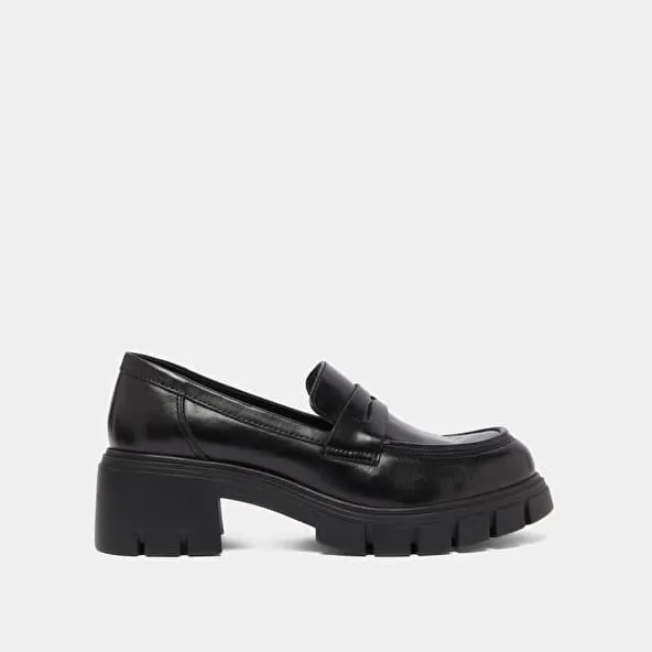 Heeled loafers with notched soles in black leather